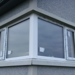 Clonmacash Rd Portadown White fixed  corner window with top opening sashes to both ends.
