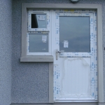 Clonmacash Rd Portadown White pvc door with T&G half panel.